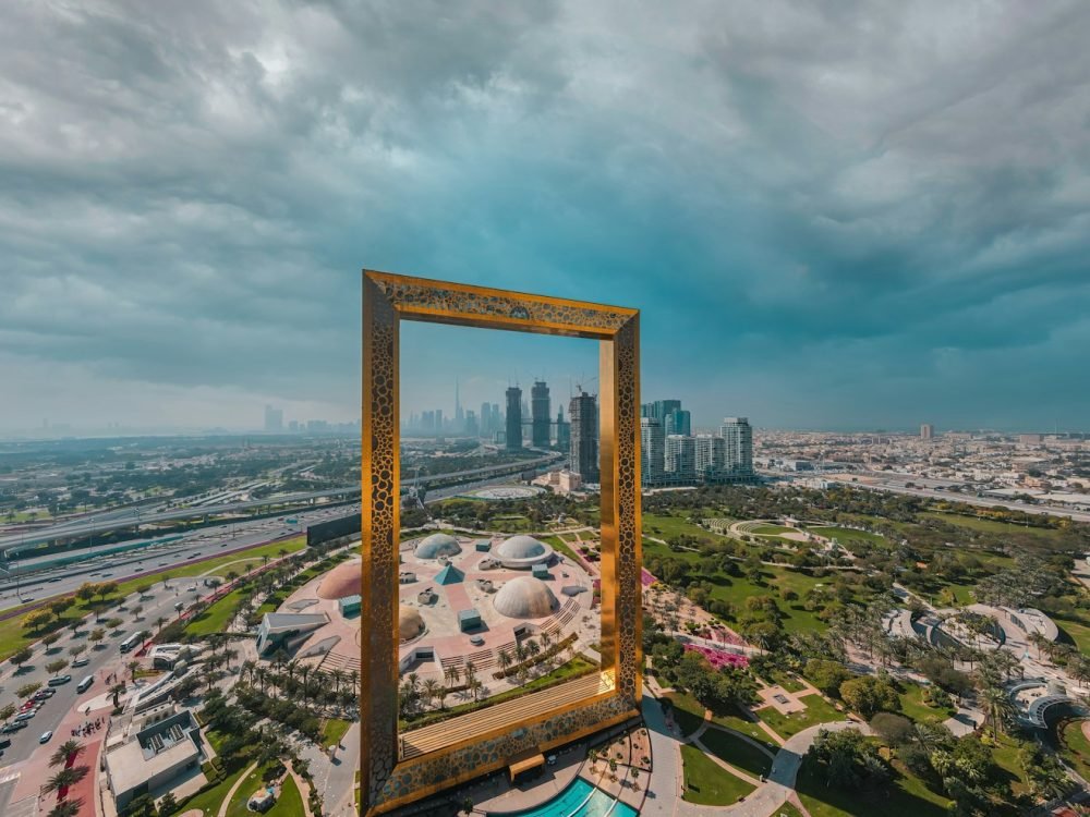 brown wooden framed mirror on top of a building