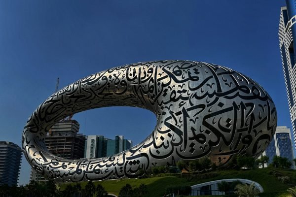 a large metal sculpture with a circular design on it